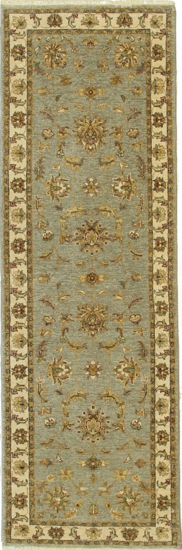A sage green runner rug displays intricate gold and tan traditional floral designs and a wide cream border.