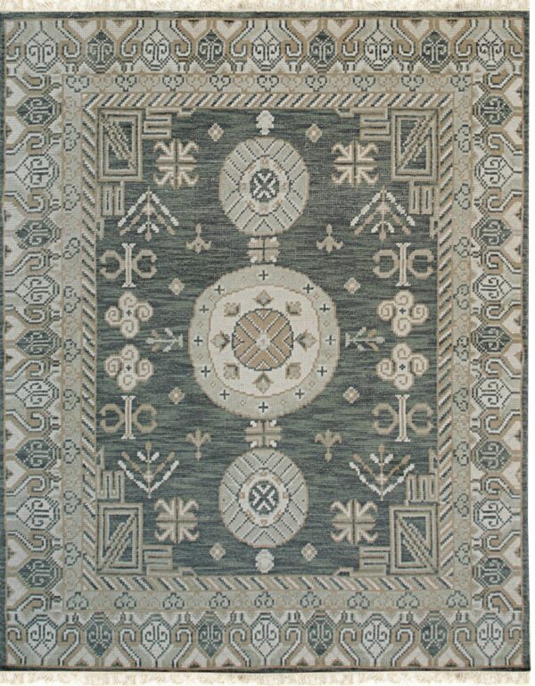 Geometric rug in deep sage green with multiple borders and central medallions in light tan and cream.