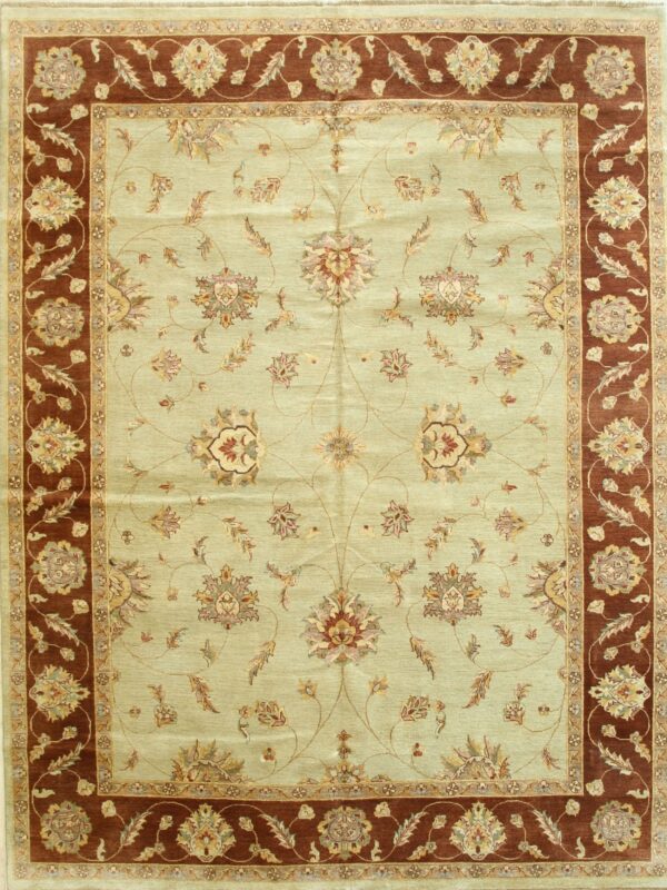 Pale sage green area rug displaying a detailed floral medallion pattern and wide red-brown ornamental borders.