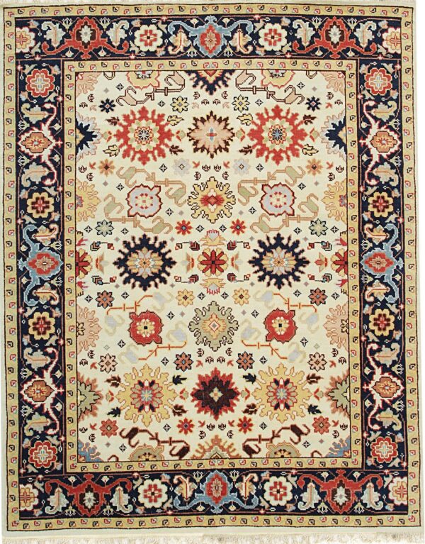 Ivory rug featuring repeating traditional medallions in red, navy, and gold, with a dark blue border.