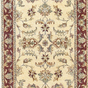 Elegant ivory rug with intricate patterns.