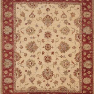 Traditional rug with a cream field and maroon borders featuring ornate floral motifs.