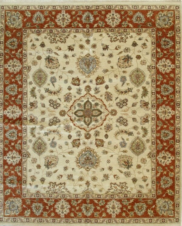 Traditional rug featuring a detailed multicolored floral pattern on a cream field and a wide rust-colored border.