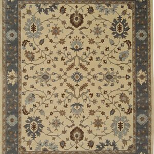 Rectangular rug displaying an all-over floral pattern in blue, brown, and cream with a gray border.