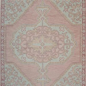 Rose and light blue rug featuring a traditional ornate central medallion and stylized floral borders.