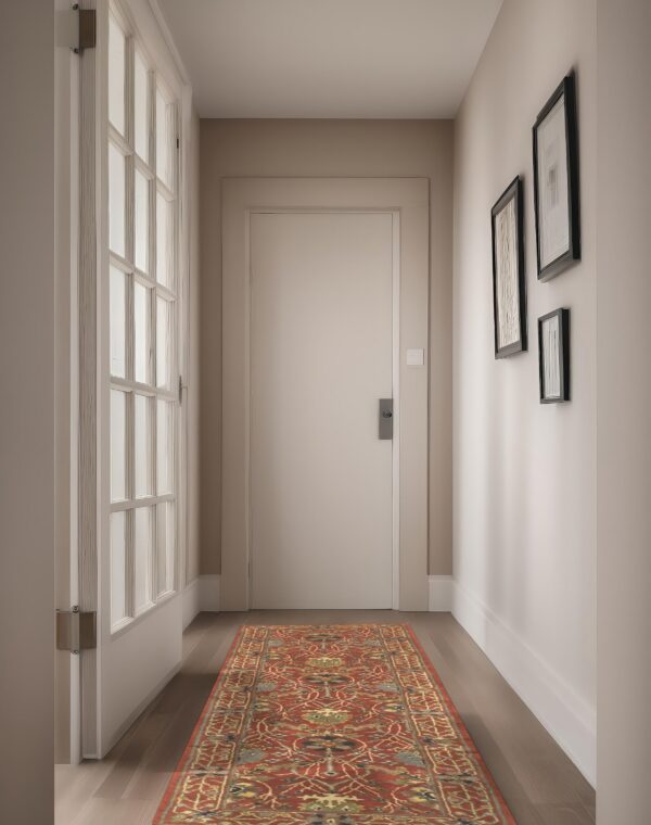 Traditional red, gold, and blue runner rug laid on dark wood flooring in a light-painted hallway.