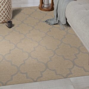 Beige rug featuring a gray trellis design partially under a sofa on light wood flooring.