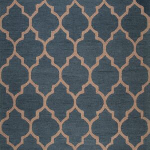 A close-up view of a blue rug featuring a repeating tan geometric trellis pattern.