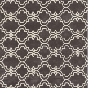 Dark gray medium pile rug with a repeating off-white quatrefoil geometric lattice design.