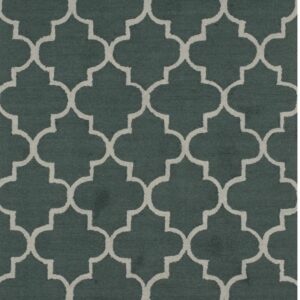 Dark teal rug featuring a repeating light gray quatrefoil geometric pattern.