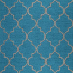 A textured turquoise rug displays a repeating light gray quatrefoil trellis pattern across the surface.