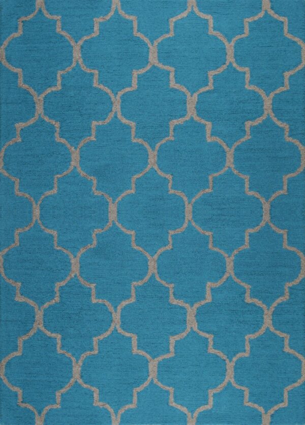A textured turquoise rug displays a repeating light gray quatrefoil trellis pattern across the surface.