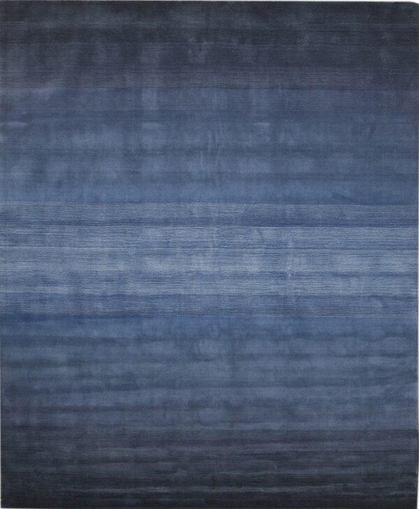 Low-pile blue rug featuring horizontal stripes and a visible color gradient.