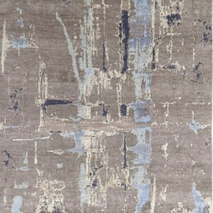 Beautiful gray rug showing an abstract pattern in patches of light blue and off-white.