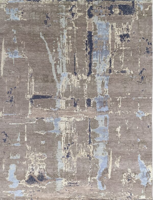 Beautiful gray rug showing an abstract pattern in patches of light blue and off-white.