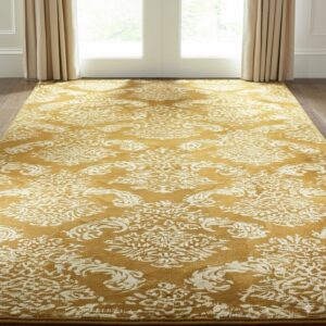 A high-contrast gold and cream rug with a distressed traditional pattern rests on dark wood flooring.