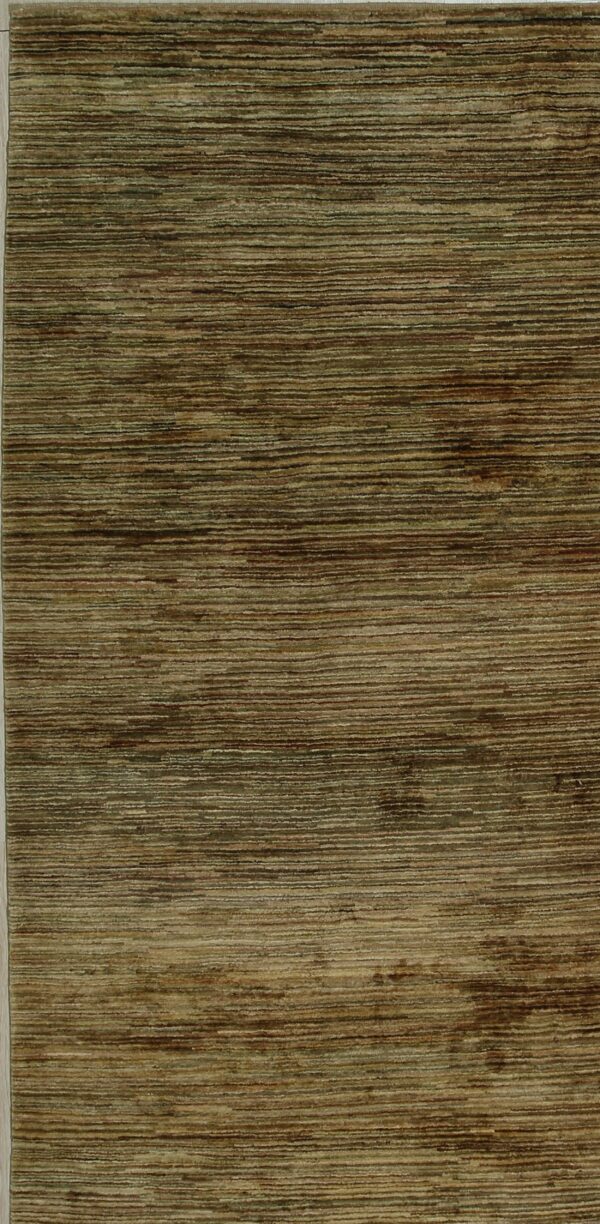 Textured rug with horizontal striations in shades of olive green, dark brown, and tan.
