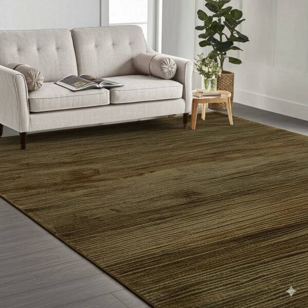 Earthy brown striped rug covers gray plank flooring, complementing a light beige tufted sofa.