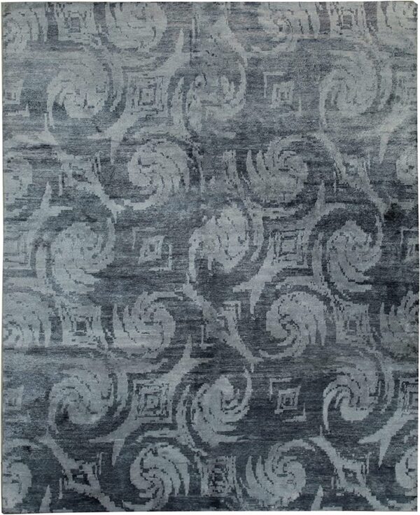 Slate gray rug with a light gray abstract pattern featuring large swirling and blurred geometric designs.