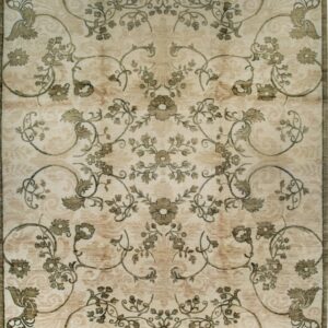Cream and beige traditional rug with a distressed symmetrical pattern of olive green floral medallions and vines.