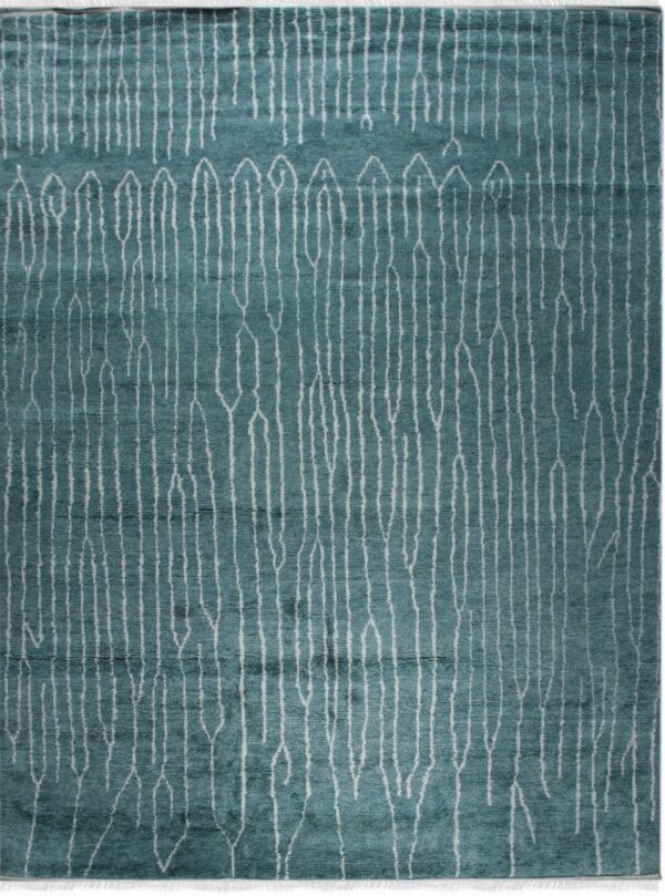 Teal area rug with a dense white pattern of long, vertical, abstract lines and shapes.