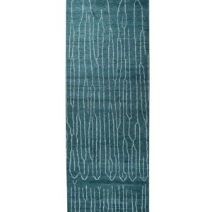 Teal runner rug featuring white abstract vertical lines and short fringe displayed on a white background.