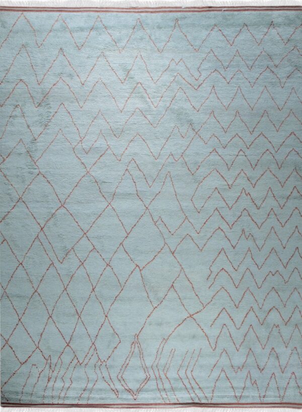 Light blue rug with irregular, repeating red zigzag lines and large geometric diamond shapes.