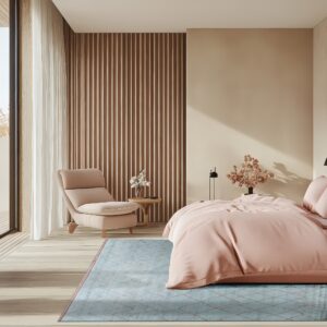 A blue low-pile rug with a copper geometric pattern lies under a pink bed in a sunny modern bedroom.