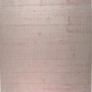 A shaggy pink rug featuring a repeating pattern of faint vertical lines and white fringe.