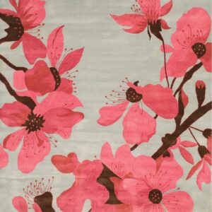 Large fuchsia flowers and dark brown branches cover a rug with a muted light blue-gray background.
