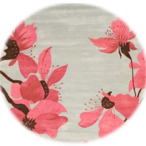 Light gray rug with large pink and brown stylized flowers around the border.