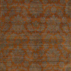 Rust and slate blue rug featuring a repeating damask pattern with visible horizontal texture and striations.