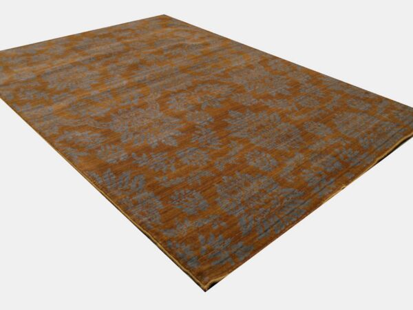 Rust-colored low-pile rug with subtle slate gray botanical motifs displayed on a white background.