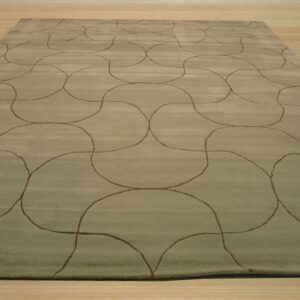 A rectangular sage rug featuring a repeating brown continuous line pattern rests on light wood flooring.