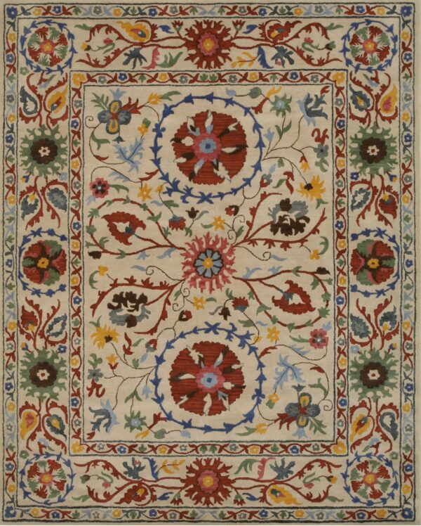 Ivory rug with ornate floral designs in red, blue, green, and yellow across the field and multiple borders.