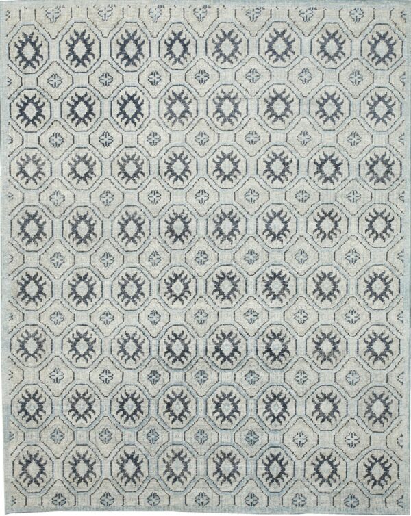 Light gray rug with a repeating geometric trellis pattern featuring dark navy star motifs and light blue accents.
