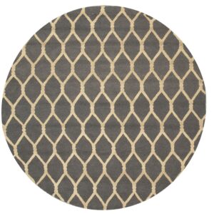 Round dark gray rug with a repeating light beige geometric ogee trellis pattern.