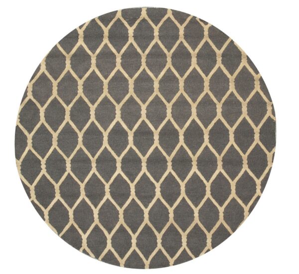 Round dark gray rug with a repeating light beige geometric ogee trellis pattern.