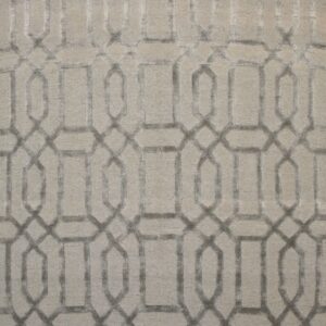 Short pile rug in pale gray featuring a dark gray recessed geometric trellis design.