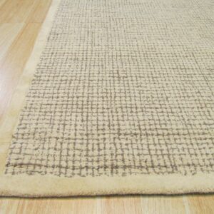 Textured beige rug with a chunky gray grid pattern and solid border sits on light wood planks.