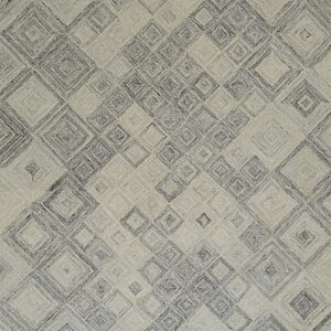 Textured gray and cream rug displaying an overall pattern of nested, striated diamonds.