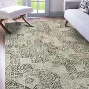 Neutral rug with a textured brown and beige geometric print lies under a white chair and gray sofa.