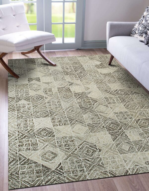 Neutral rug with a textured brown and beige geometric print lies under a white chair and gray sofa.