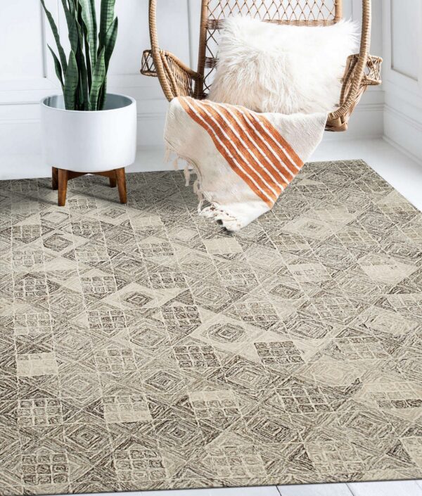 Highly textured neutral rug with geometric patterns displayed in a bright room beside a wicker chair and potted plant.
