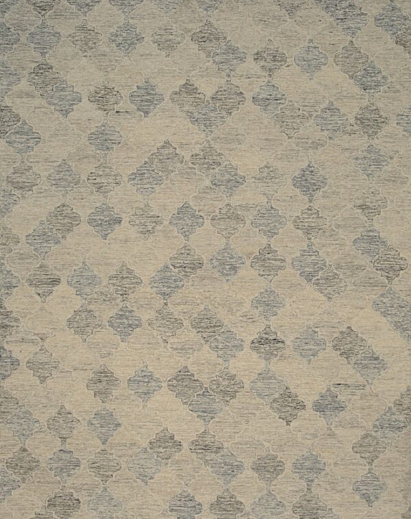 A textured rug featuring a beige ground and repeating dark blue-grey quatrefoil pattern.