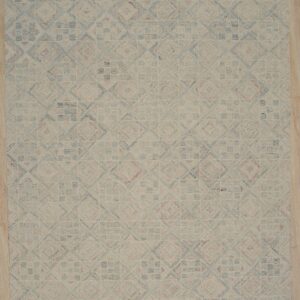 Light geometric rug featuring blue and pink tiled patterns over a beige field on light wood flooring.