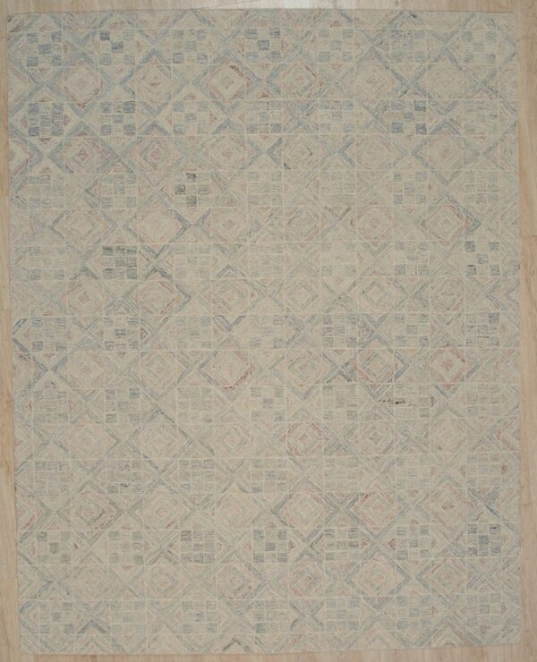 Light geometric rug featuring blue and pink tiled patterns over a beige field on light wood flooring.