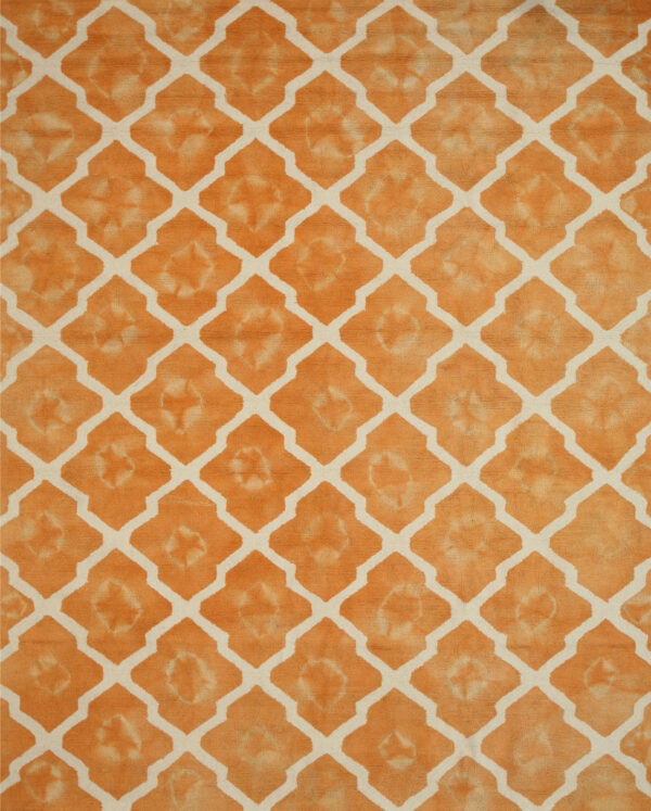 Textured, high-pile orange rug with a cream geometric trellis pattern and subtle color variations within the motifs.