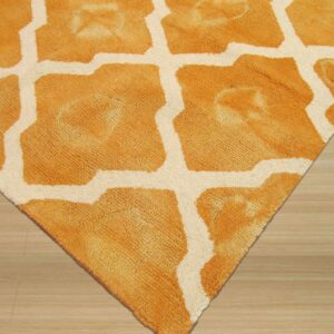 A textured orange and cream Moroccan lattice rug lies on light wood flooring.