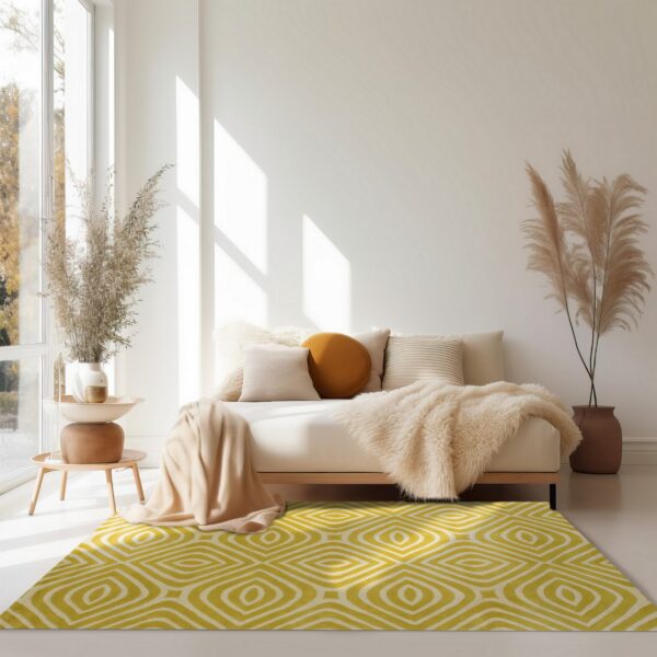 Yellow and cream geometric rug grounds a sunlit, neutral living room with a cream daybed.